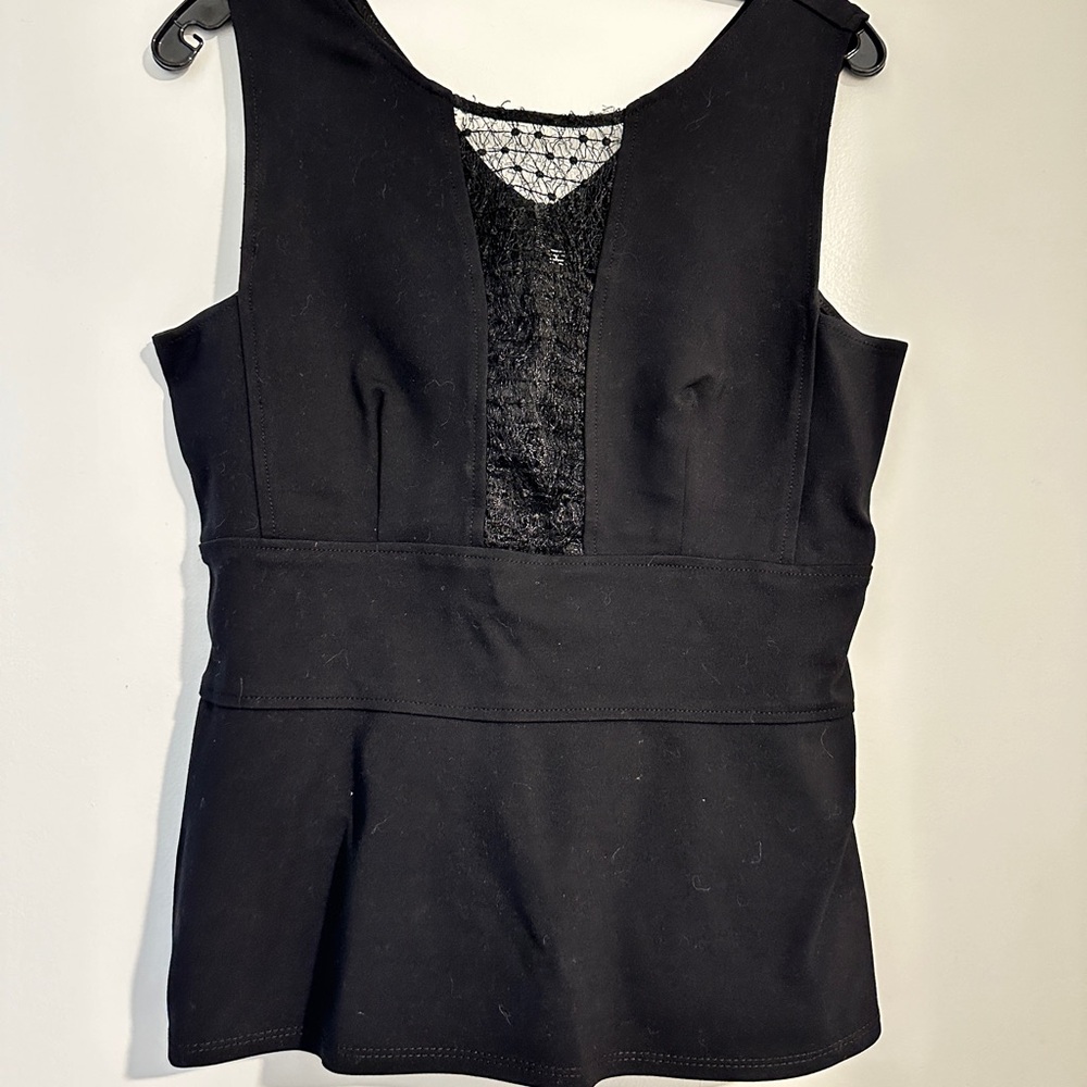 Yoana Baraschi black peplum top with sheer inlay